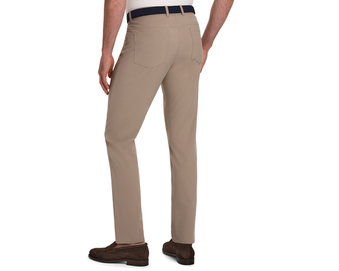 Rear view of The McDaniel 5 Pocket Pant: Fescue, featuring straight-leg cut and back patch pockets, paired with a woven belt and suede loafers.