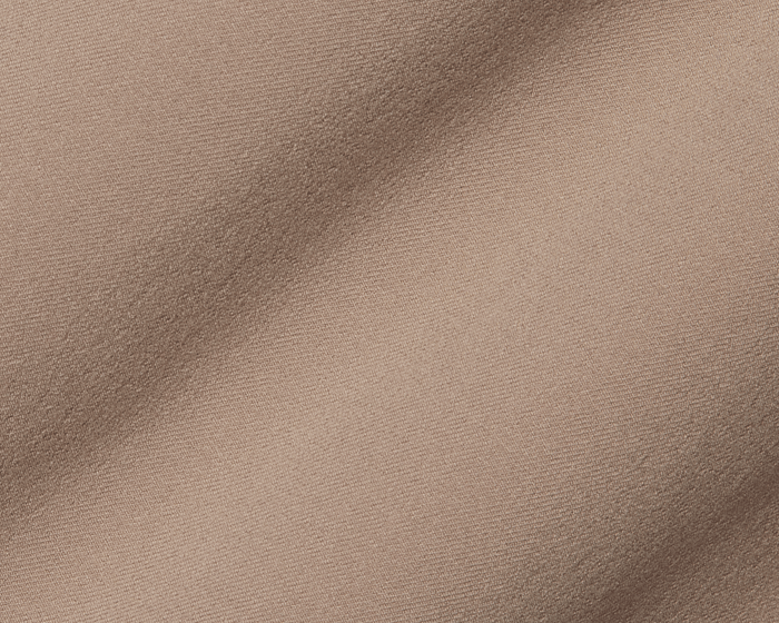 Close-up of The McDaniel 5 Pocket Pant: Fescue, showing its tan-beige woven fabric with fine weave and gentle folds, highlighting its performance and comfort features.
