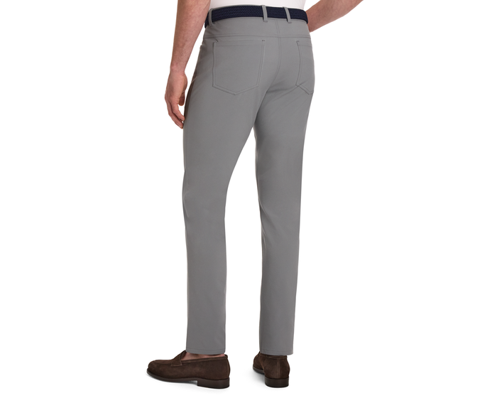 The McDaniel 5 Pocket Pant: Light Gray on model, featuring slim-fit design, straight legs, two back pockets, and a navy belt with brown suede loafers.