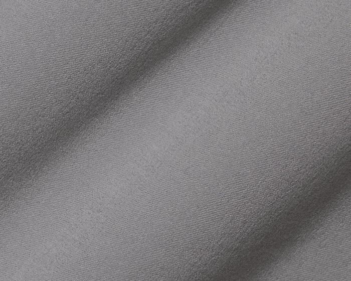 The McDaniel 5 Pocket Pant: Light Gray, showcasing a close-up of its fine woven texture, gentle drape, and wrinkle-resistant, eco-friendly performance fabric.