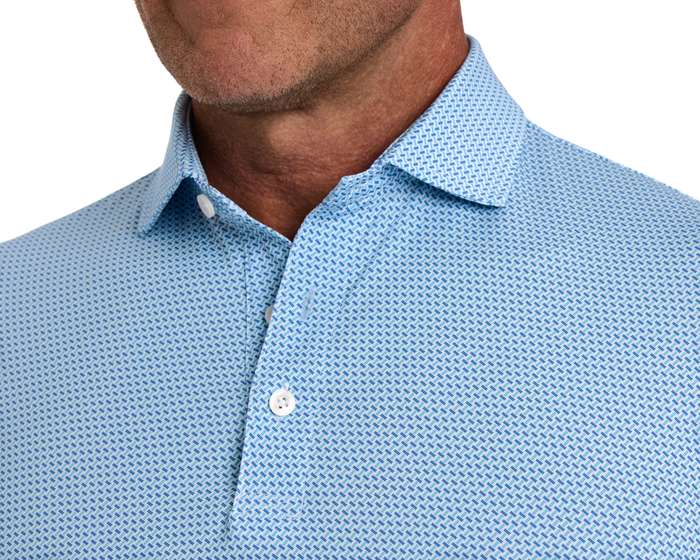 The Norman Shirt: Harbor & Maidstone Blue features a light-blue geometric pattern, white buttons visible, ideal for comfort with UPF 50+ protection and breathability.