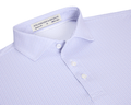 The Norwood Shirt: Vista Blue & Tudor features a folded, light lavender geometric pattern, spread collar, and white buttons, offering stylish versatility and comfort.