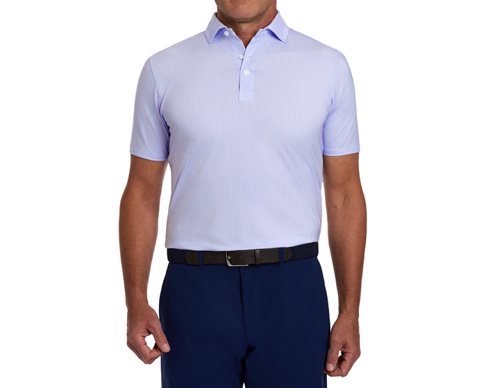 The Norwood Shirt: Vista Blue & Tudor, featuring a geometric basketweave pattern, tucked into navy trousers with a dark braided belt, showcasing a structured collar.