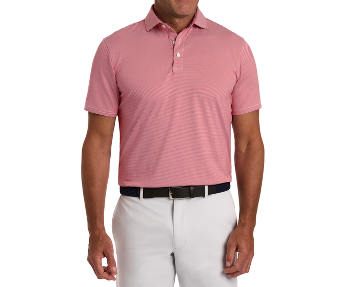Man wearing The Perkins Shirt: Liberty Red & White, featuring fine stripes, a structured collar, tucked into gray trousers, styled with a navy braided belt.
