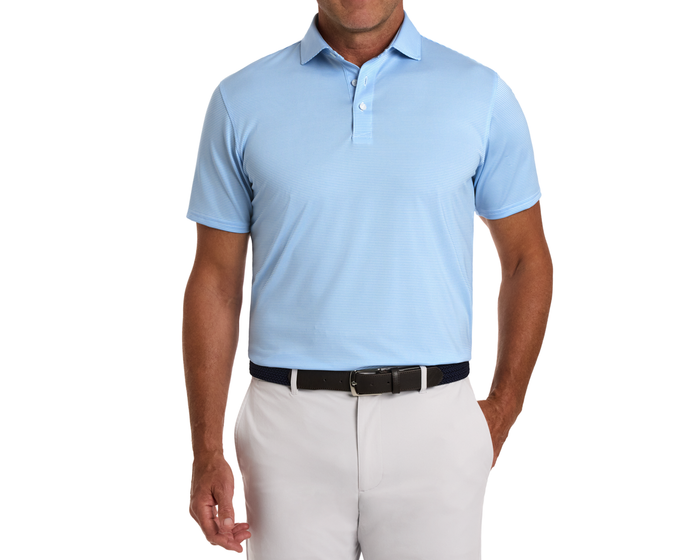 The Perkins Shirt: Vista Blue & White on a man, showing its striped pattern, structured spread collar, and lightweight, moisture-wicking fabric with UPF 50+ protection.