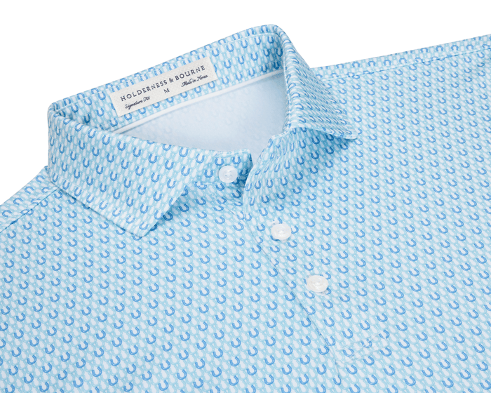 The Rivers Shirt: Harbor & Maidstone Blue with small horseshoe motifs, button-up style, structured collar, offering comfort, moisture-wicking, breathability, and UPF 50+ protection.