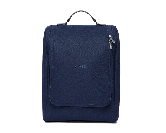 The Rutledge Shoe Bag: Navy Ballistic - Navy Embroidery, a compact, box-shaped tote with a top handle, zippered side, front flap with CMB initials.