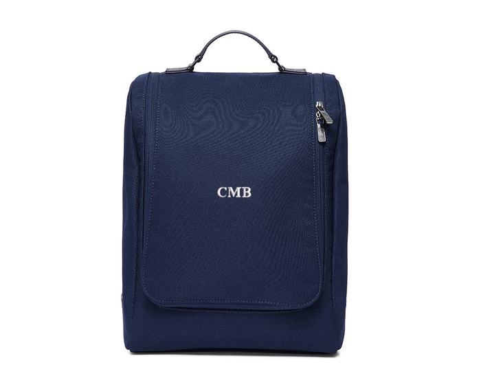 The Rutledge Shoe Bag: Navy Ballistic - White Embroidery, featuring a structured design with a top handle, zip compartment, front pocket, and personalized initials CMB.