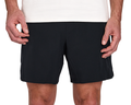 Person wearing The Saunders Short: Black, featuring a quick-drying tech blend and four-way stretch, with hands resting at sides.