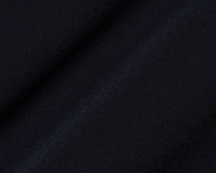 Close-up of The Saunders Short: Black, showcasing its fine knit texture and subtle folds, highlighting its quick-drying, stretchable fabric designed for optimal performance.