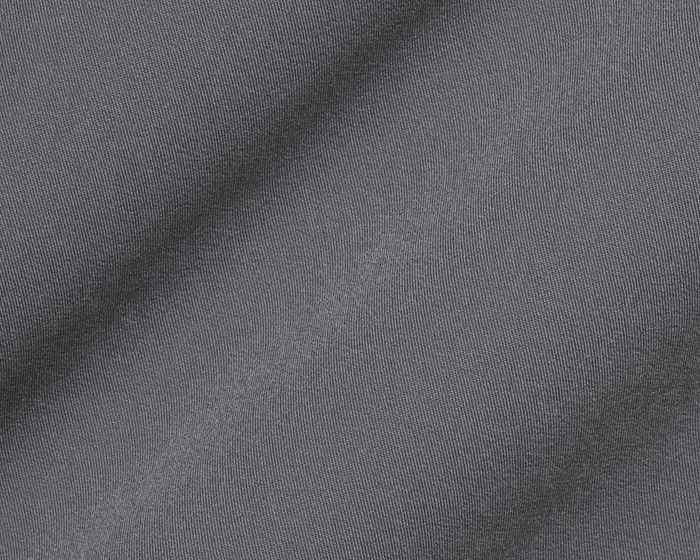 Close-up of The Saunders Short: Iron Gray, showcasing its fine diagonal rib-like texture, gentle folds, and performance fabric designed for stretch and breathability.