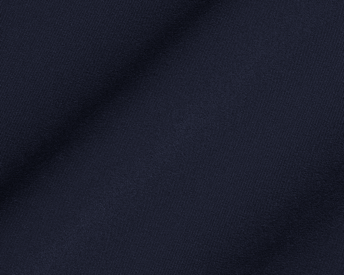 The Saunders Short: Navy, showcasing its dark blue woven fabric with a subtle drape, highlighting the fine weave and texture for optimal performance.