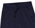 The Saunders Short: Navy athletic pants featuring an elastic drawstring waistband, dual side hand-warmer pockets, and a zip pocket for secure storage.