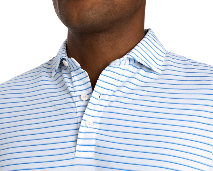 The Springer Shirt: White/Vista Blue/Horizon Blue with fine stripes, featuring a structured collar, two-button placket, and breathable AIRATION® fabric for performance.