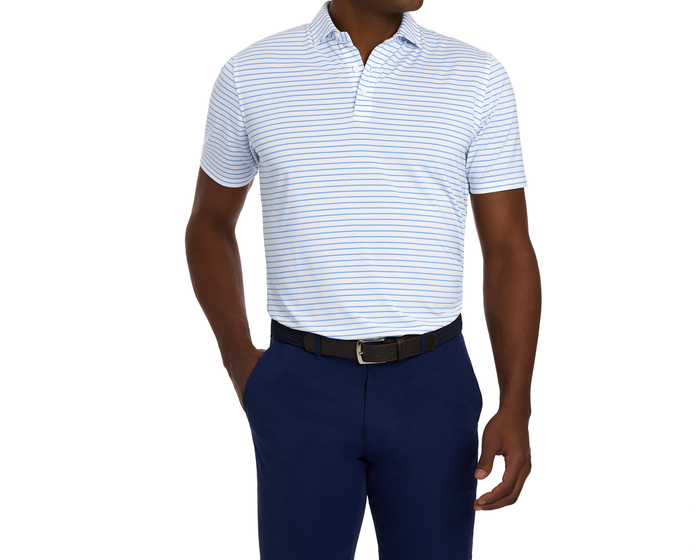 Man wearing The Springer Shirt in white with light-blue stripes, tucked into navy trousers, showcasing the structured collar and casual fit.