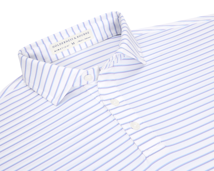 The Springer Shirt: White/Vista Blue/Tudor, features a collared button-up design with light-blue stripes, crafted from breathable, moisture-wicking AIRATION® fabric with UPF 50+ protection.