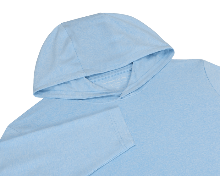 The Stowe Hoodie: Heathered Vista Blue, featuring a light blue pullover design, visible hood, shoulder, partial sleeve, and interior Holderness & Bourne label for an ultra-soft, athletic fit.