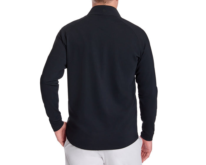 Man wearing The Stuart Quarter-Zip: Black, a long-sleeve pullover with subtle textured rib fabric, paired with light-colored pants, shown from the back.