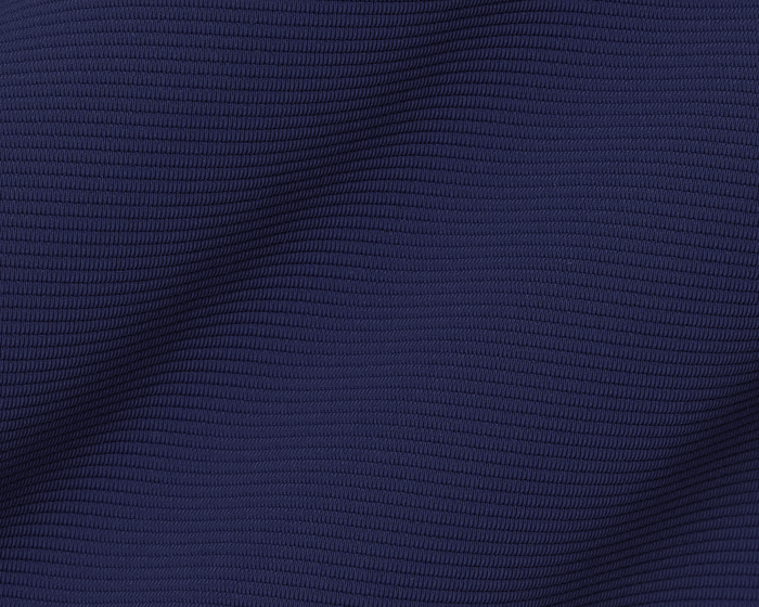 The Stuart Quarter-Zip: Navy features a close-up of its ribbed texture, highlighting the gentle folds and luxurious lightweight performance fabric.
