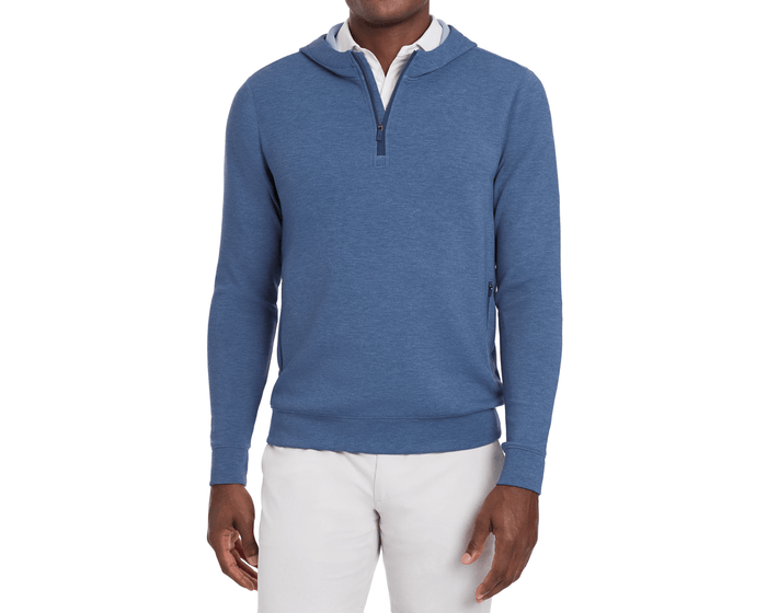 The Tilley Quarter-Zip Hoodie: Heathered Andover, shown on a model, offers a sleek, versatile fit ideal for travel and cool mornings.