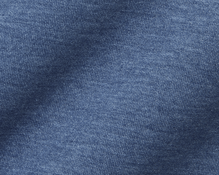 Close-up of the blue knit fabric of The Tilley Quarter-Zip Hoodie: Heathered Andover, highlighting the intricate weave pattern and soft texture for versatile wear.