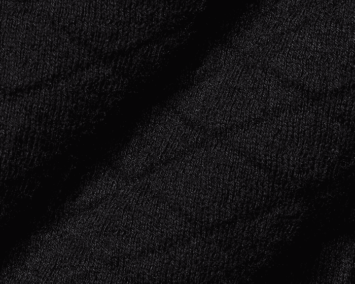 Close-up of The Wallace Hoodie Sweater: Black, showing intricate knit stitches and folded fabric, highlighting its 100% Egyptian cotton texture and ribbed side panels.