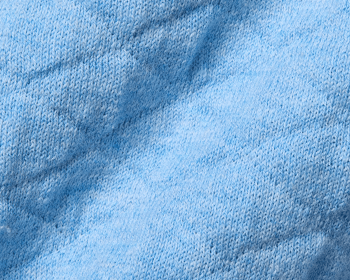 Close-up of The Wallace Hoodie Sweater showing detailed yarn loops in a soft knit, crafted from 100% Egyptian cotton for a warm, modern look.
