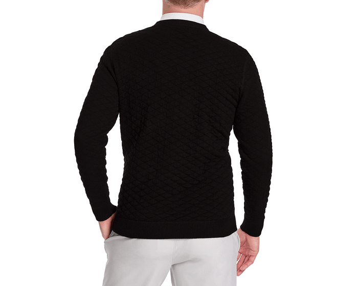 The Ward Crewneck Sweater: Black, featuring a diamond-quilted texture, showcased from the back, paired with light gray pants, exuding comfort and versatility.