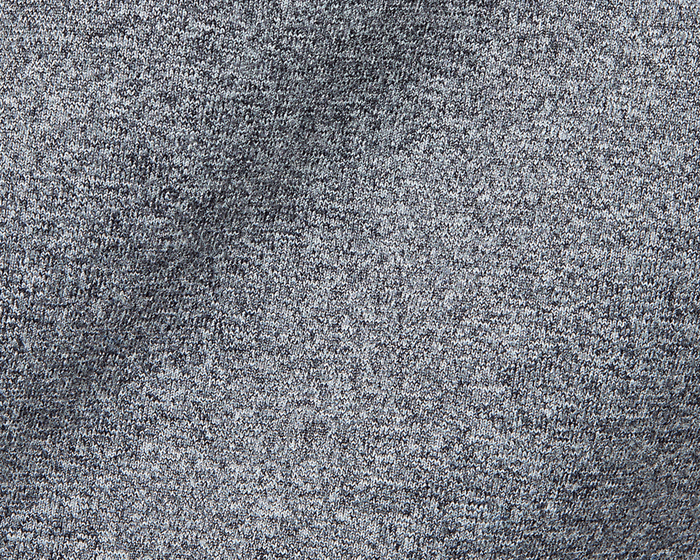 Close-up of The Westland Boys Quarter-Zip: Charcoal, highlighting its grey knitted texture with interlocking loops, showcasing the soft, versatile fabric design.