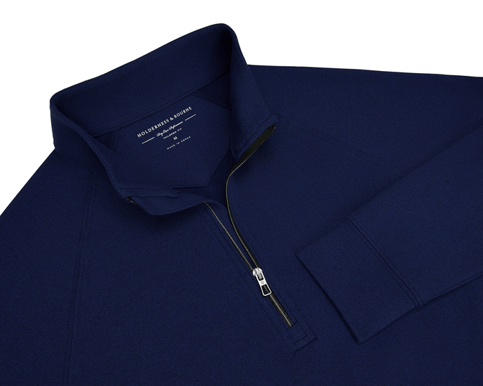 The Westland Boys Quarter-Zip: Navy, features a stand-up collar, quarter-zip front, and performance fabric, offering UPF 50+ protection and a soft, stretchy feel.