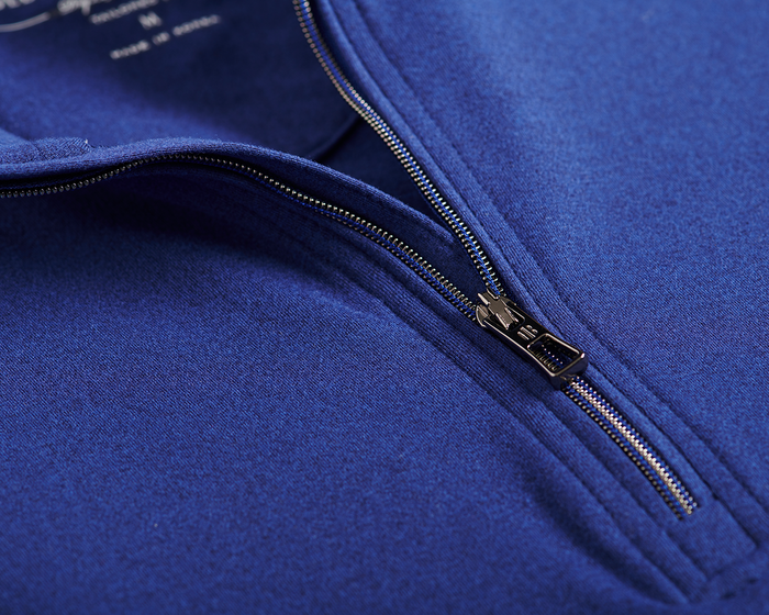 Close-up of The Westland Boys Quarter-Zip: Navy, highlighting the partially unzipped metal zipper on the soft, performance fabric with chrome accents.