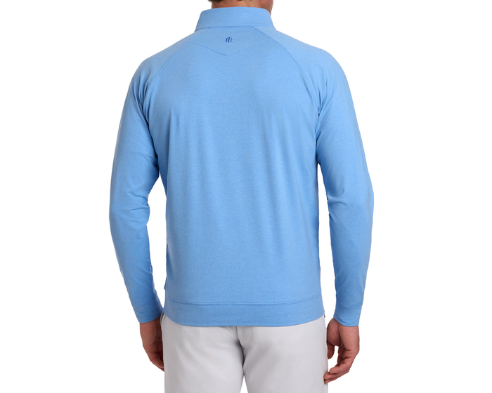 The Westland Quarter-Zip: Heathered Vista Blue, shown from the back, highlights its sleek design and gunmetal chrome trim on a lightweight, moisture-wicking fabric.