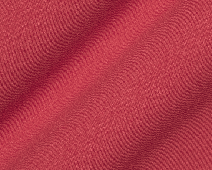 The Westland Quarter-Zip: Liberty Red showcases a fine knit texture with gentle folds, highlighting its soft, peached synthetic blend for versatile performance.