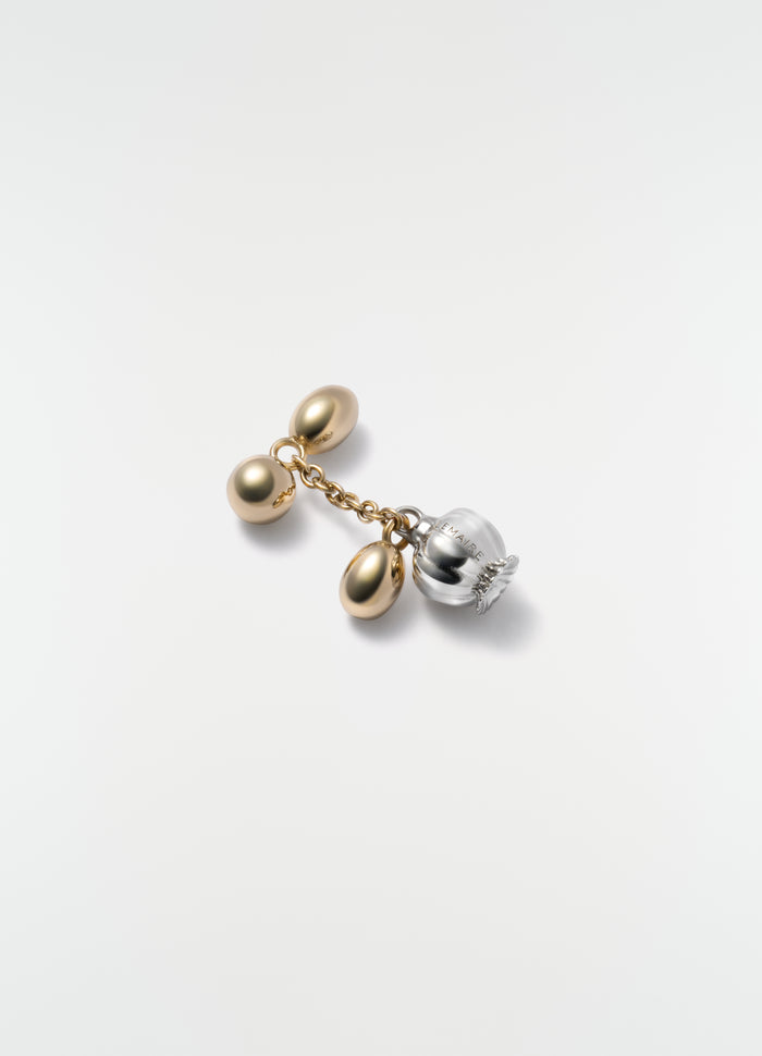 Thistle buttonhole ornament in brass with silver detail by LEMAIRE on plain white background close-up detail