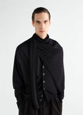 Trompe L'Oeil black merino blend scarf by LEMAIRE worn by model with matching black cardigan front view