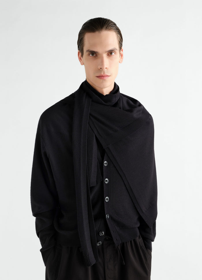 Trompe L'Oeil black merino blend scarf by LEMAIRE worn by model with matching black cardigan front view
