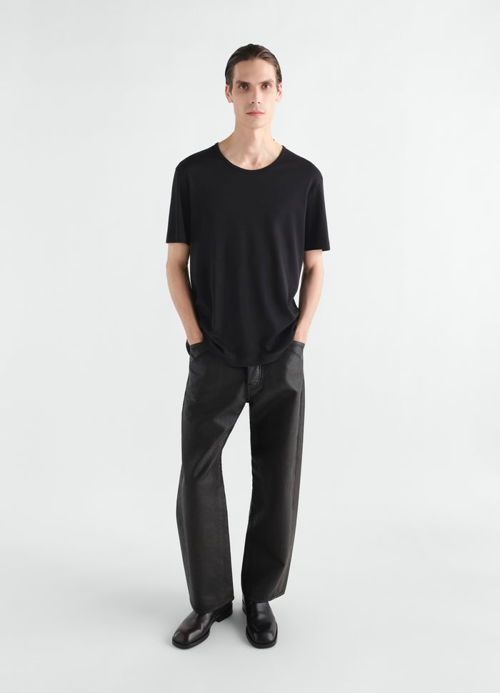 Scoop-neck black ribbed jersey T-shirt by LEMAIRE worn by a model front view on white background