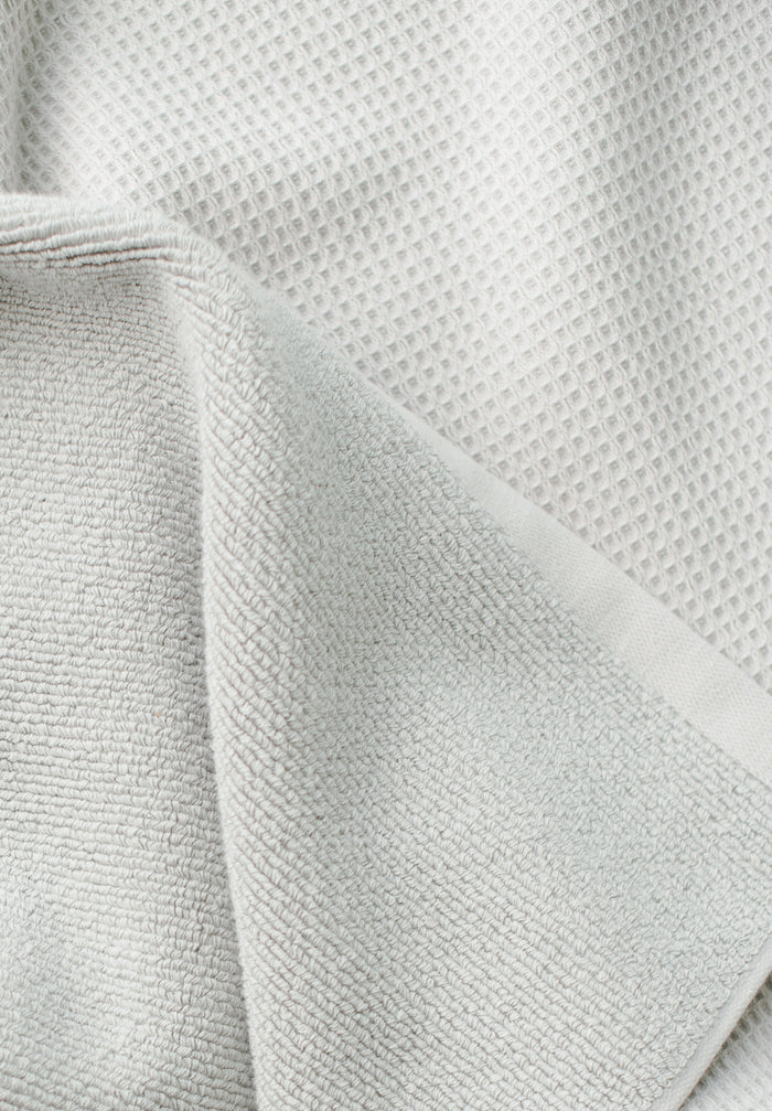 Waffle Bath Towel in the color Light Grey. Photo of Light Grey Waffle Bath Towel taken close up only showing the towel |Color: Light Grey