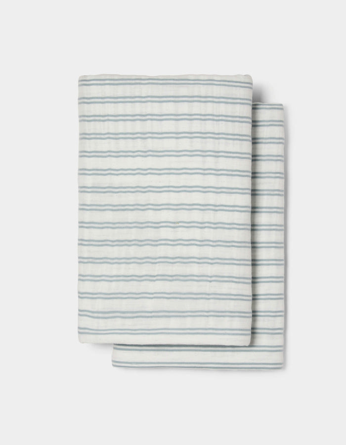 The Cozy Earth Waterfront Shams feature a neatly folded white design with thin, evenly spaced horizontal blue stripes, set against a plain white background.|Color:River Stripe