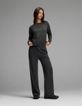 A woman stands in a relaxed pose against a plain gray background, wearing the Cozy Earth Women’s Brushed Bamboo Wide Leg Pull On Pant & Pullover Crew Set in charcoal.|Color:Charcoal