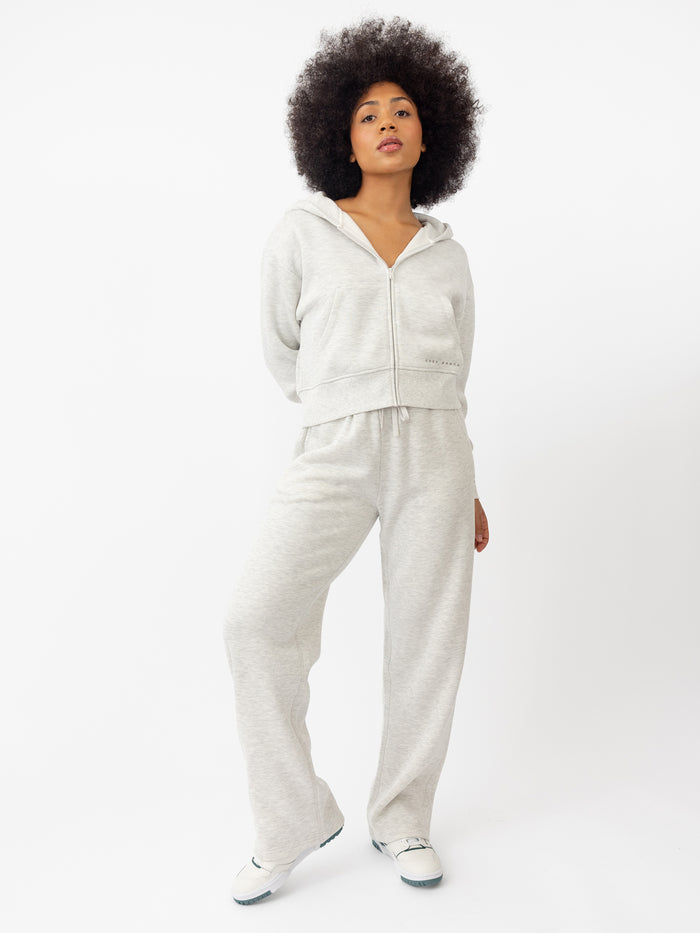 Woman wearing Heather Grey CityScape Cropped Full Zip with white background |Color: Heather Grey