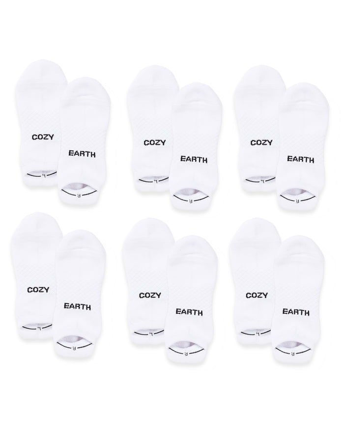 Six pairs of Cozy Earth Essential Ankle Socks are arranged in two rows on a white background. Each white sock features either "COZY" or "EARTH" in black text on top. |Color:White