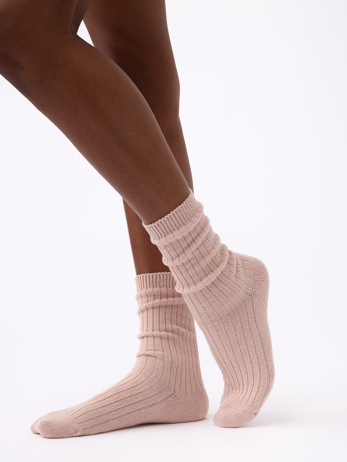 Person turned to the side wearing Cozy Earth Plush Lounge Calf Sock 1-Pack in Dusty Rose |Color:Dusty Rose