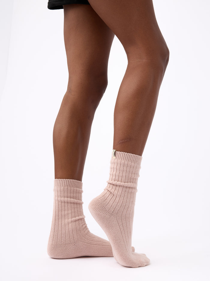 Person turned to the side wearing Cozy Earth Plush Lounge Calf Sock 1-Pack in Dusty Rose |Color:Dusty Rose