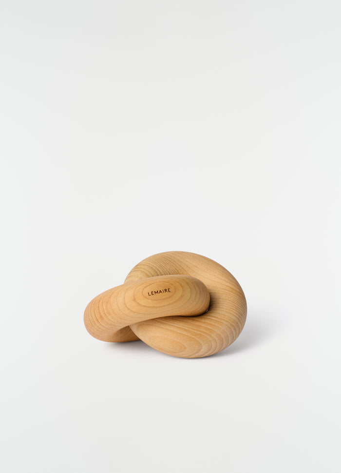 Wood Link M wooden accessory in natural tone by LEMAIRE on plain white background close-up detail