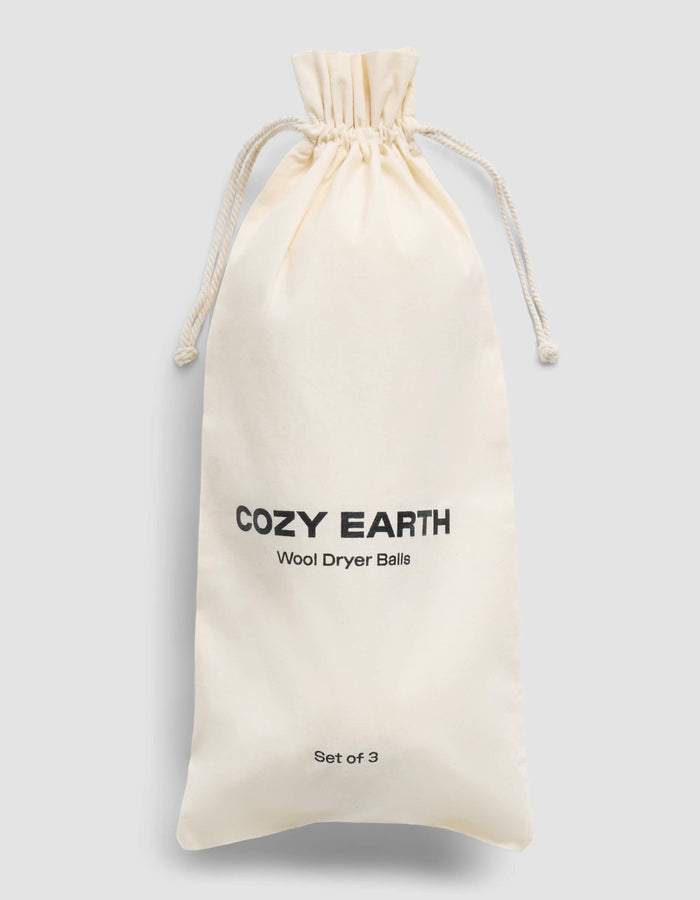 A cream-colored drawstring bag with "Cozy Earth" and "Wool Dryer Balls" printed in black on the front, labeled as a set of 3, is shown against a plain light gray background.|Size:Regular