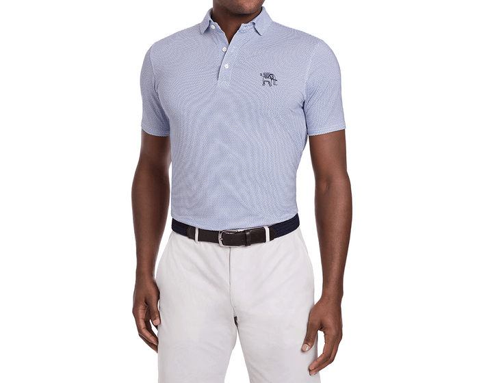 Model in a Yale Golf Course Armfield Shirt: Andover, showcasing a light-blue polo with a micro-print and embroidered logo, paired with beige trousers and a navy belt.