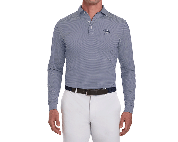 Man wearing Yale Golf Course Burke Shirt: Navy & White, featuring fine stripes, embroidered bulldog logo, tucked into white trousers with dual belts.