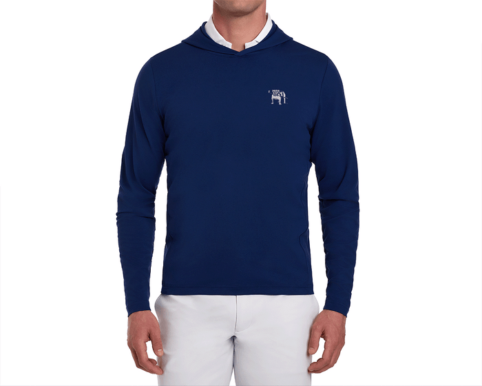 Man wearing Yale Golf Course Jackson Pullover: Navy, slim-fit with small white bulldog logo, over white shirt, paired with light-colored pants.