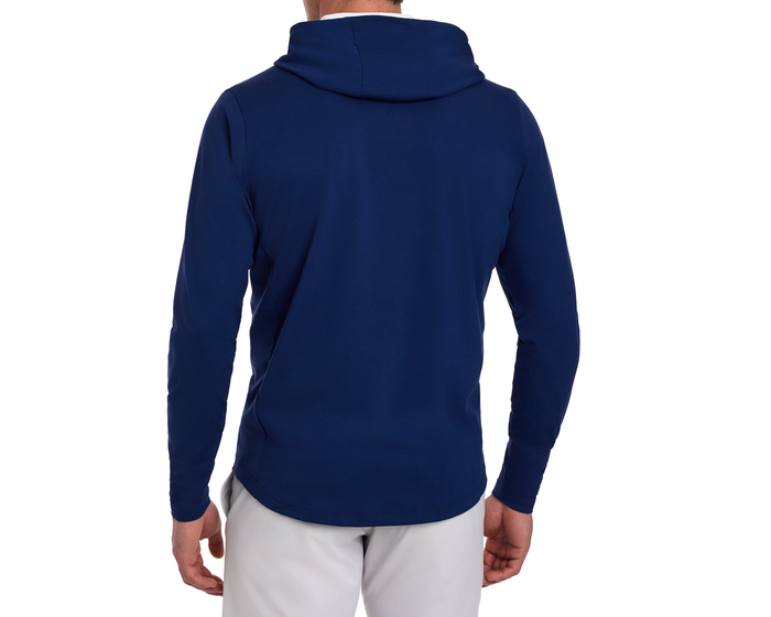 Back view of a person wearing the Yale Golf Course Jackson Pullover in navy, showcasing its sleek, hooded design, paired with light-colored pants.
